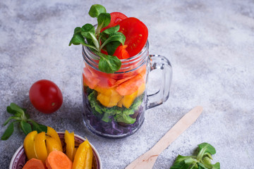 Vegetarian rainbow salad in a glass jar
