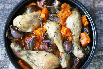 Baked chicken legs with pumpkin and blue onions. Healthy food. Keto diet.