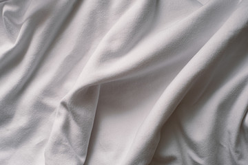 Fototapeta premium Crumpled Soft White Textile Backdrop - Wrinkled Cloth Background