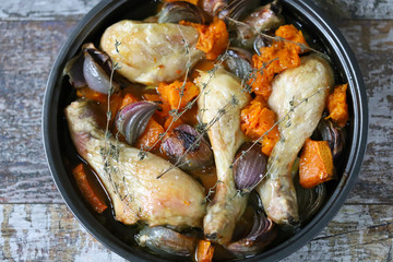 Baked chicken legs with pumpkin and blue onions. Healthy food. Keto diet.