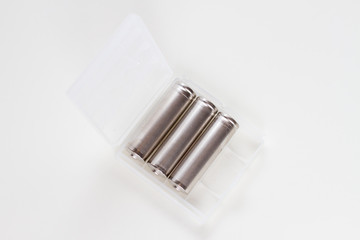 AA factor batteries in a plastic case, close up