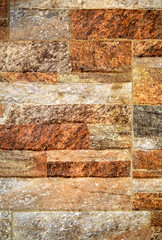 A background of colorful stone wall close up view