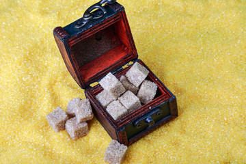 brown sugar cubes in a toy suitcase