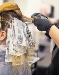 The process of dyeing hair at the hairdresser