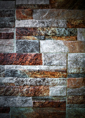 A background of colorful stone wall close up view