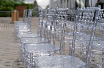 Chiavari chairs are transparent, at a beautiful wedding event.