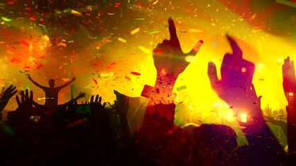 Fototapeta premium Concert Music festival and Celebrate. Party People Rock Concert. Crowd Happy and Joyful and Applauding or Clapping. Celebration party festival happiness. Blurry night club. Concert Show with DJ Music 