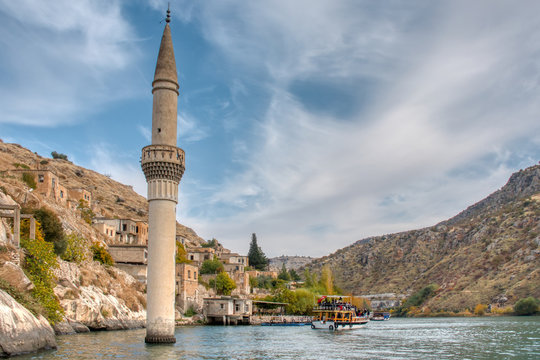 Minaret of the mosque in the water of the dam