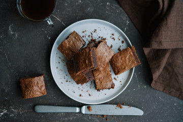 Homemade chocolate brownies on dark background