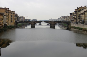 View of the Ponte Santa Trìnita, or the St. Trinity Bridge, as seen from the Ponte Vecchio in Florence, Italy 