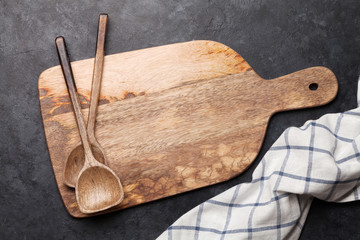 Kitchen table with utensils and tablecloth