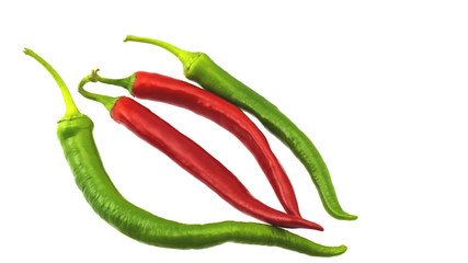 Pods of red and green hot pepper on a white background