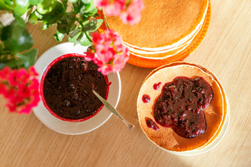 Real food. Pancakes on the table with home flower. Authentic breakfast