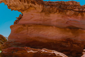 Scenic cliffs on a sandy tropical Thai beach.