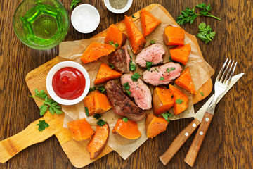 Roast beef with baked pumpkin.