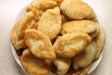 Pies with potatoes fried in oil tasty food