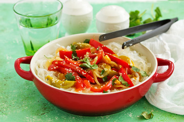 Baked bell peppers with rice noodles in Asian style.