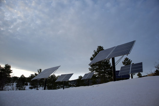 solar panels on a snowy mountain renewable energy concept