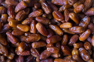 top view texture of dried dates fruits. Dietary nutrition, vegetarians, natural healthy nutrition
