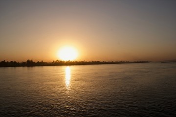 Sunset viewed from across a river