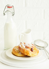 Bun with raisins and cream. Selective focus