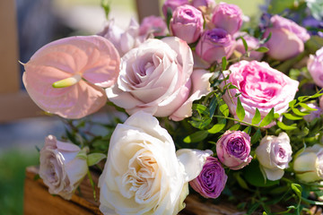 Bouquets of fresh flowers decoration of the festive table. Celebrating an open air party. Decor Details