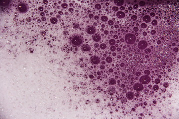 Pink background with soap suds