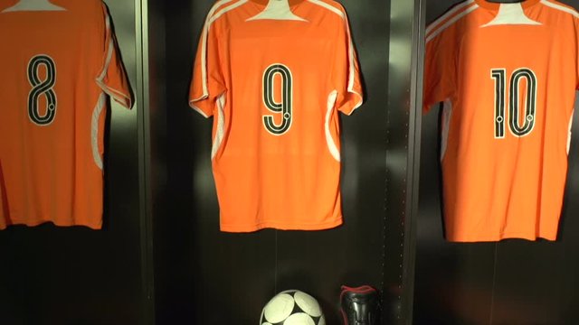 Soccer /&nbsp; Football Changing room / Locker room. All the kit or uniform is laid out ready for the players. Crane Shot