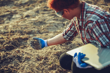 Researchers are checking the soil and collecting soil samples for planting.