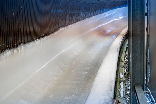 Bobsleigh Ice Channel In Winterberg. The Digital Clock Measures The Speed. Curvy Trail In The Ice.