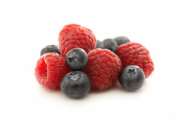 Raspberries and blueberries isolated