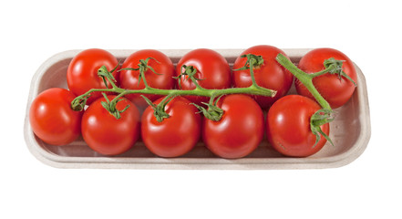 Box with juicy small organic vine ripe tomatoes