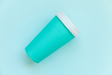 Simply flat lay design blue paper coffee cup on blue pastel colorful trendy background. Takeaway drink container. Good morning wake up awake concept. Template of drink mockup. Top view copy space