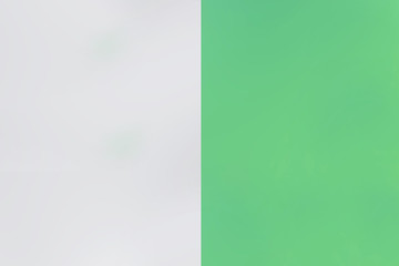 Two stripes of color green and white split diagonally