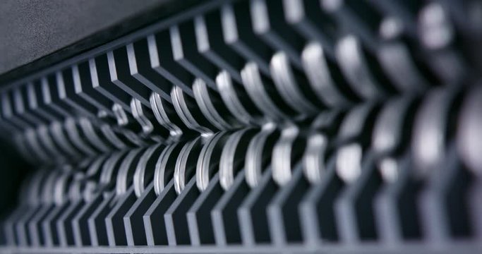 Close up of shredder jaws turning narrow depth of field close up macro