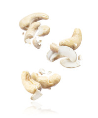 Group of crushed cashew in the air close-up on a white background
