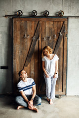 Young happy couple near the loft door