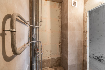 Bathroom. Empty interior for design, gray concrete wall. Empty room. Space for text and picture. Concrete walls, slabs, interior of a new residential building. Partitions in a new apartment.