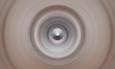 Abstract round background. Circles from the center point. Image of diverging circles. Rotation that creates circles.