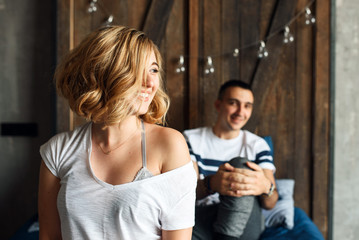 Young couple in love laughing in bed