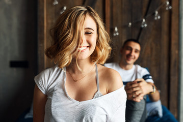 Young couple in love laughing in bed