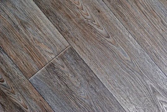 wooden background from a parquet board. toning and diagonal pattern
