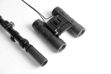 sniper optical scope for rifle and binoculars close-up on a white background. optical accessories...
