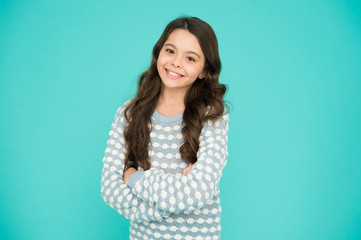 Fototapeta premium Child care. Happy childhood. Beautiful kid. Emotional girl. Little girl blue background. Smiling small girl with long hair. Beauty and health. Childhood and girlhood. International childrens day