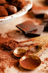 Delicious homemade chocolate preparation process. Vintage kitchen tableware. Intense brown color, aromatherapy. Dark and moody, macro, flat lay, top view