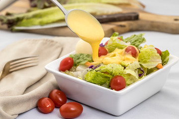 Honey mustard dressing on a salad.