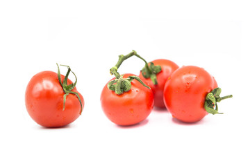 ripe fresh organic tomatoes in drops of water Isolated on a white background