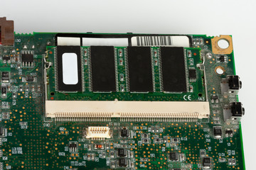 Close up of latop memory module on slot of laptop motherboard on white background