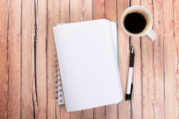 blank notebook with pen on a wooden table, business concept concept of a new workplace