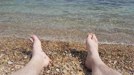 Pale feet on the beach